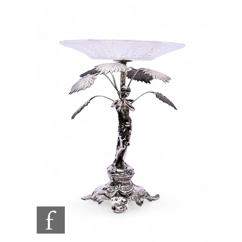 529 - A late 19th Century WMF (Wurttembergische Metallwarenfabrik) table centre modelled as a male figure ... 