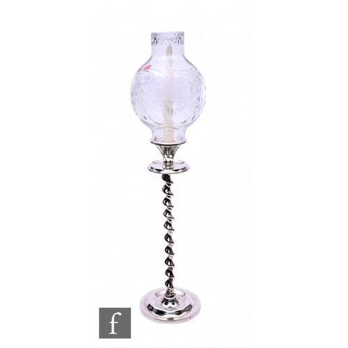 531 - A large early 20th Century silver plated candlestick, the stepped circular base below a tall barley ... 