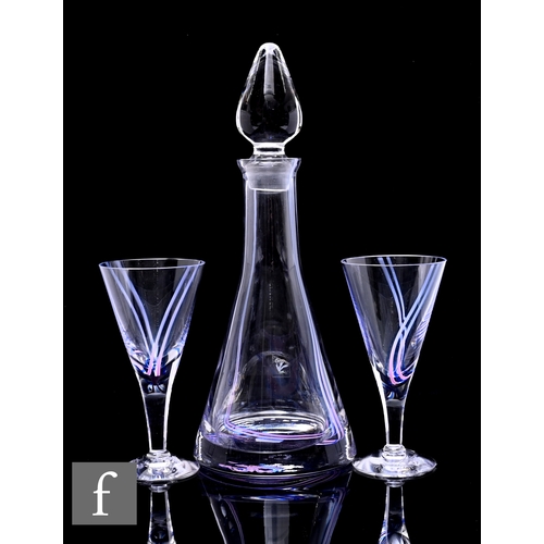 311 - A Caithness Charisma decanter and stopper, of conical form with teardrop stopper, internal pink and ... 