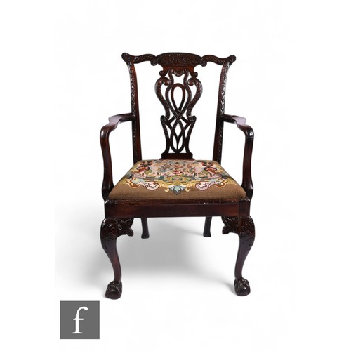 836 - A late 18th Century mahogany framed open armchair in the Chippendale style, with carved back rail an... 