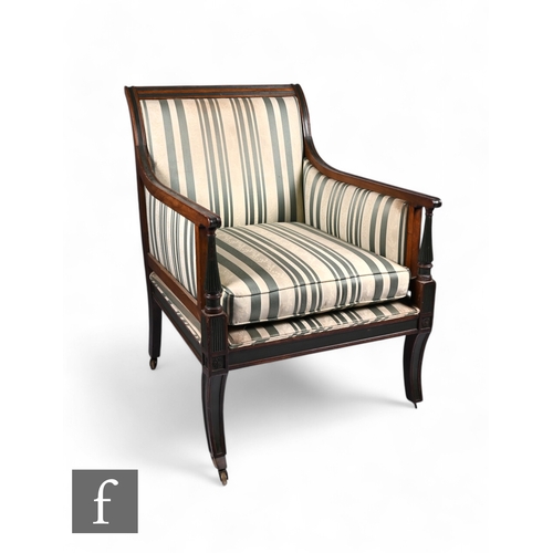 839 - A 19th Century mahogany library armchair in the Regency style, with green painted highlights, reeded... 