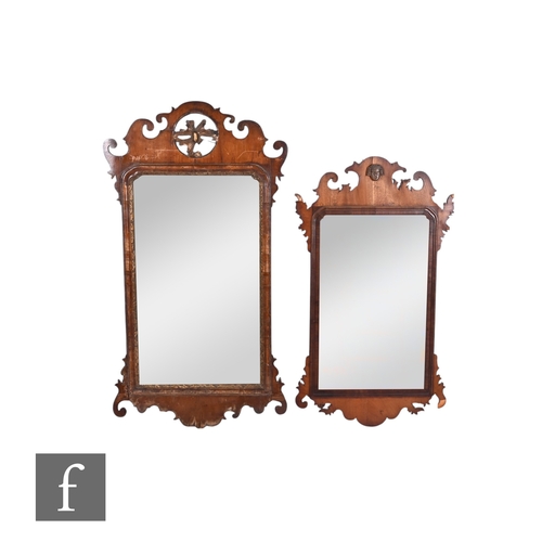 848 - Two 18th Century fret-cut walnut framed wall mirrors, each of rectangular form, the first with pierc... 