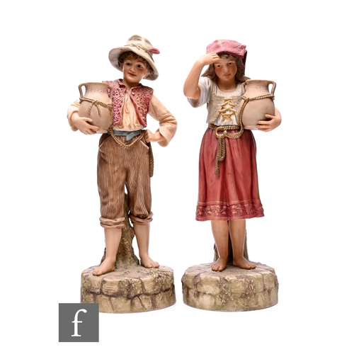 65 - A pair of Robinson & Leadbeater late 19th Century hand-coloured parian figures, modelled as Ital... 