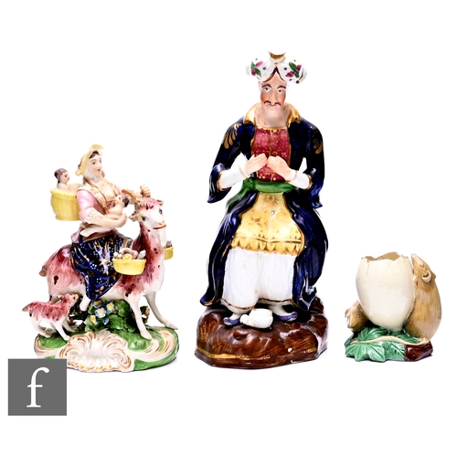 70 - A Derby figure of the Welsh Tailor's Wife, circa 1790, modelled seated on a goat with laden panniers... 