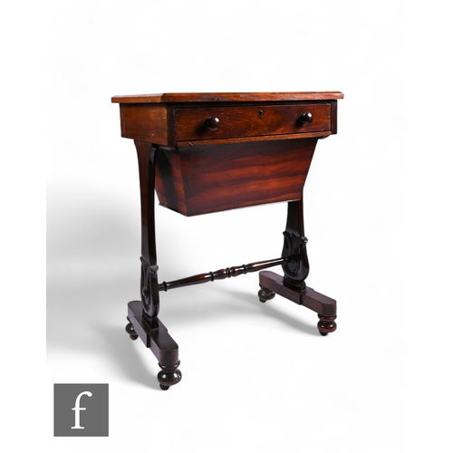 850 - A 19th century mahogany work table fitted with a single frieze drawer and bag slide on shaped end su... 