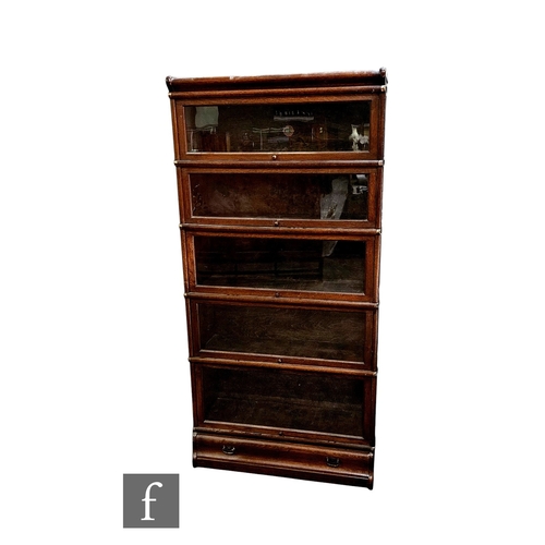 855 - A 1920s oak Globe Wernicke five tier sectional bookcase over a base drawer, height 178cm x depth 31c... 