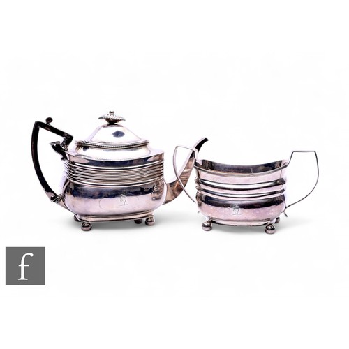 404 - A hallmarked silver George III teapot and sugar bowl by Peter and William Bateman, London 1809, of b... 