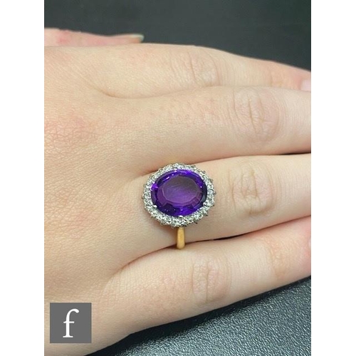 1 - An 18ct amethyst and diamond cluster ring, central oval amethyst within a border of sixteen individu... 