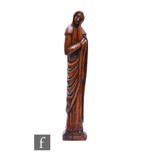 583 - A 19th century or earlier oak carving of a weeping Madonna holding a garment, in the manner of Eric ... 