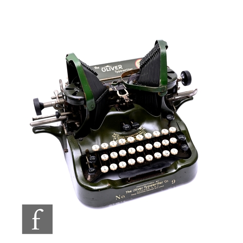 593 - An Oliver No 9 Batwing typewriter finished in green, working keys.