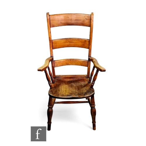 825 - A 19th Century bar back elbow chair on ring turned legs and stretchers.