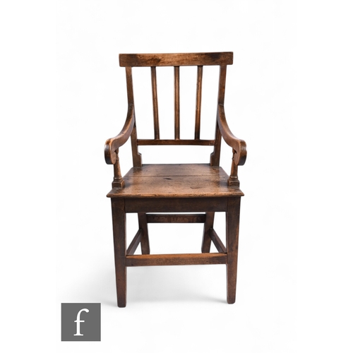 863 - A 19th Century child's ash and beech framed carver chair, with reeded lath back above a solid seat a... 