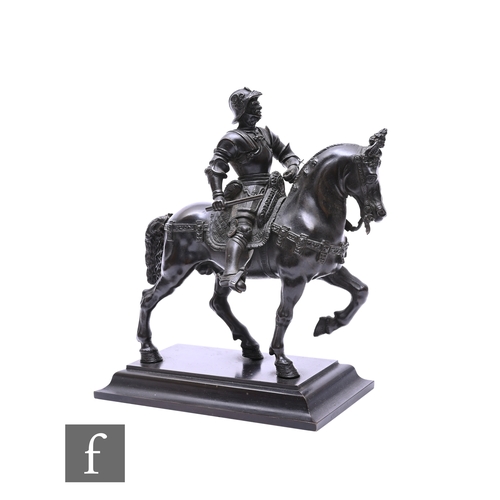 463 - A late 19th century bronze model of a conquistador in full armour on horseback, on stepped plinth ba... 