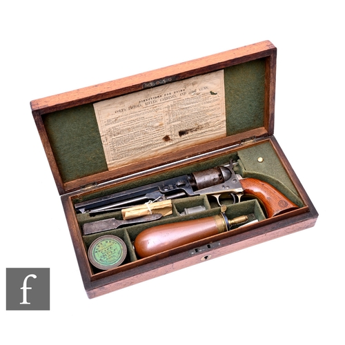 A .36 Colts naval percussion revolver No 186594, 18.5cm octagonal barrel, New York address, in fitted oak case with powder flask and tools, width 36cm.