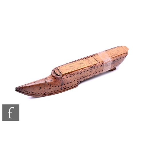 515 - A set of early 19th Century French bone dominoes, concealed inside a shoe but in boat form, the cove... 