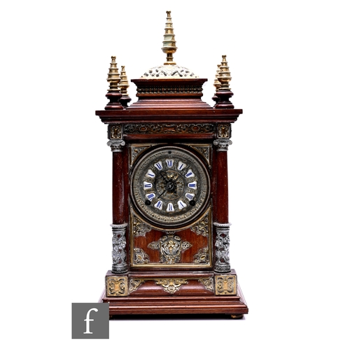 739 - A late 19th Century mahogany mantle clock, eight day striking movement on a gong, brass cone spire f... 