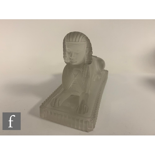 278 - A Molineaux, Webb & Co pressed glass figure of an Egyptian Sphinx circa 1875, the rectangular pl... 