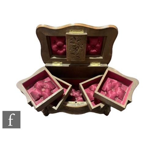 560 - A near pair of late 19th Century Black Forest jewellery boxes, one mounted with a carved figure of a... 