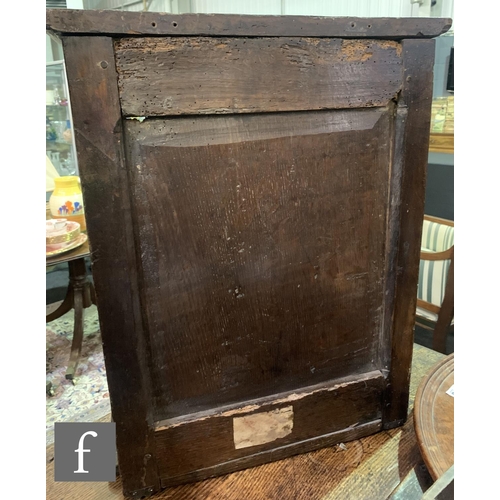 872 - A 17th Century oak dole cupboard, with chip carved detail and turned spindle door, height 58cm, widt... 