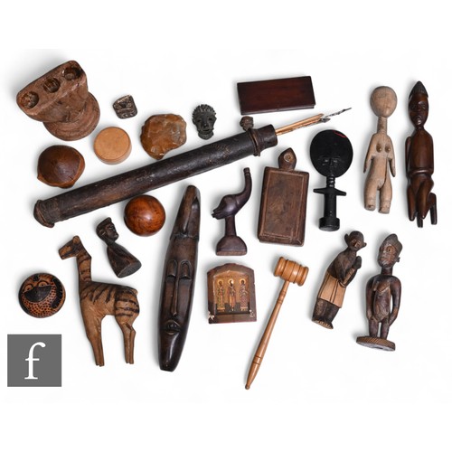 524 - A collection of mid 20th Century and later African tribal art carved hardwood figures including a le... 