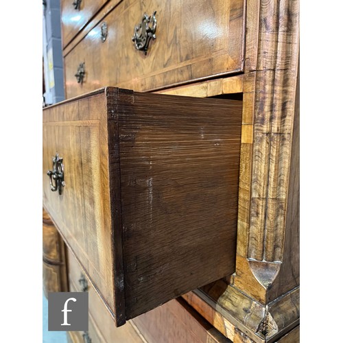 878 - An 18th Century feather banded figured walnut chest on chest, the upper section fitted with two shor... 