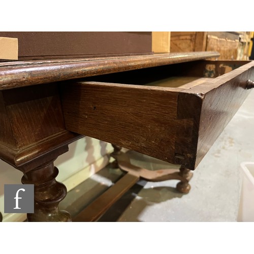 874 - An 18th Century oak side table, fitted with a single frieze drawer above bulbous barley twist turned... 