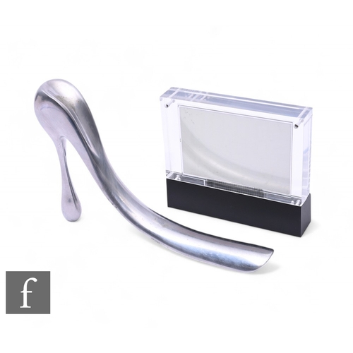 1004 - A Lennox Lewis digital LCD alarm clock by Habitat of London and a chrome shoe horn by Manolo Blahnik... 