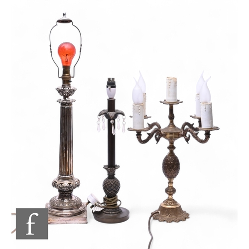 526 - An early 20th Century electroplated table lamp, reeded column on a pierced cushion and stepped base,... 