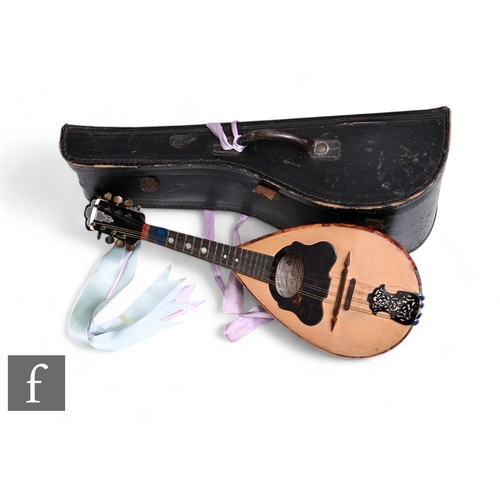 527 - An early 20th Century Italian inlaid mandolin, cased, another cased and a Romanian example. (3)