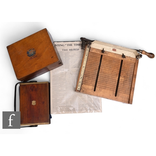 545 - A reprinted copy of the Times 1785 to 1953, a vintage guillotine, an ink roller set and an anchor co... 