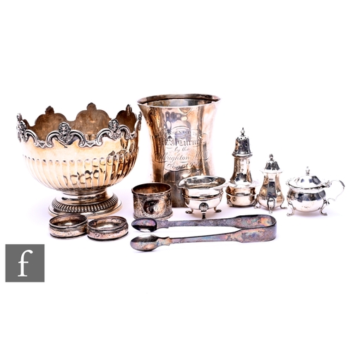 394 - A small parcel lot of assorted hallmarked silver to include a small rose bowl, a waisted tankard, a ... 