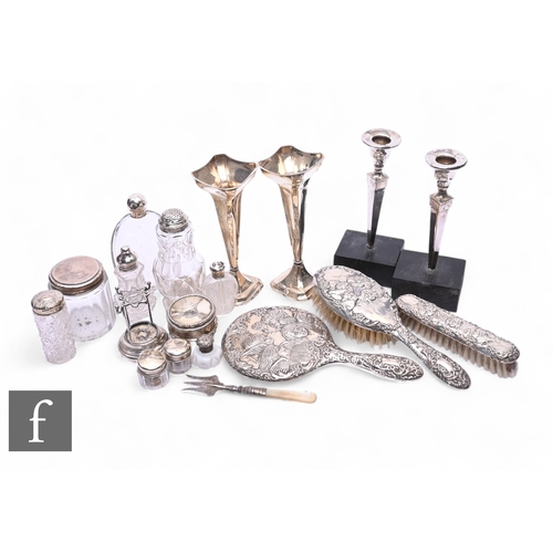 395 - A parcel lot of assorted hallmarked silver and other items to include trumpet vases, a three piece s... 