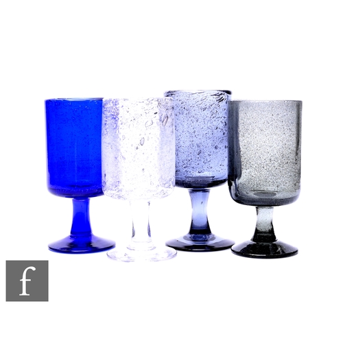 128 - Erik Höglund for Boda, four mid Century Scandinavian goblets, including blue glass example, of cylin... 