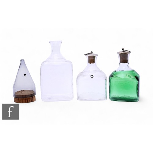 218 - Goran Warff for Pukeberg, three mid 20th Century Scandinavian flasks, including green over clear gla... 