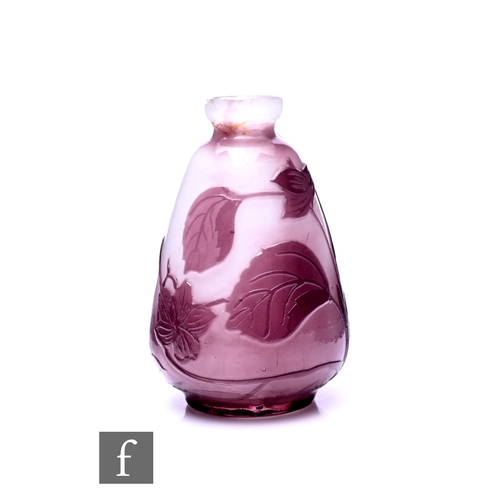 262 - An early 20th Century French Galleo cameo glass vase of ovoid form with everted rim, cased in amethy... 