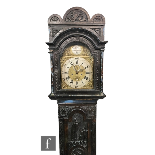 749 - An 18th Century and later carved oak longcase clock by Henry Pye Falmouth, silvered chapter ring and... 