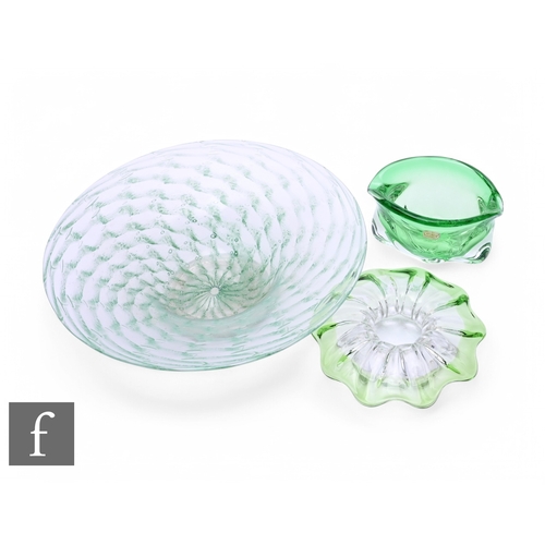 243 - A large 1930s Nazeing glass bowl of footed circular form with a wide flat rim, internally decorated ... 