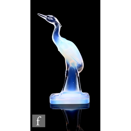 269 - A 1930s Art Deco opalescent glass figure of a walking crane raised to a rounded rectangular base, ac... 