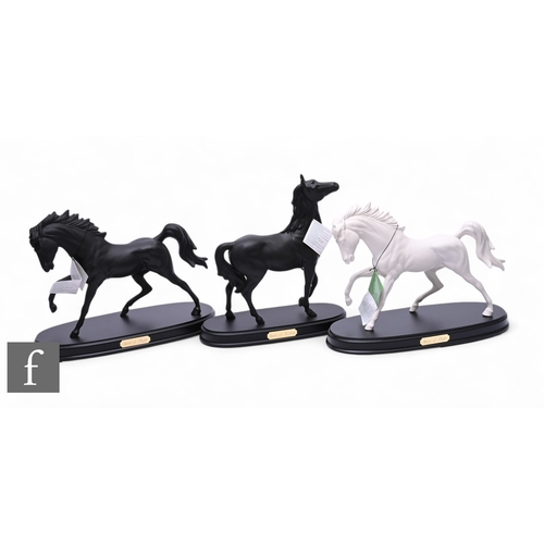 63 - Shane Ridge for Beswick, Spirit of Wisdom, modelled as a standing horse, matt black glaze, on oval p... 