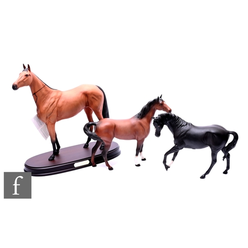 64 - A Beswick Connoisseur model, Red Rum, modelled standing, light brown matt glaze and black tail, on o... 