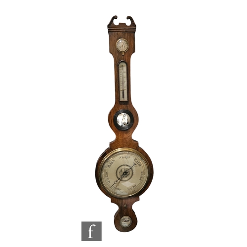 750 - A large 19th Century rosewood wheel barometer incorporating dry/damp dial, thermometer and level, he... 