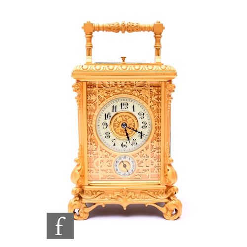 754 - A late 19th to early 20th Century French gilt carriage clock, Arabic dial and second subsidiary dial... 