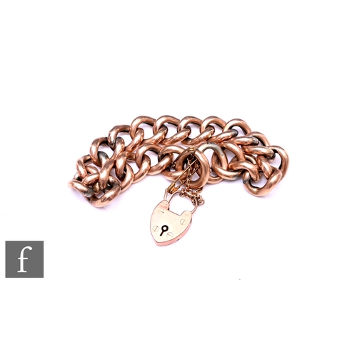 412 - A 9ct gold curb link bracelet, with heart shaped padlock clasp, total weight 26.4g, some links and p... 