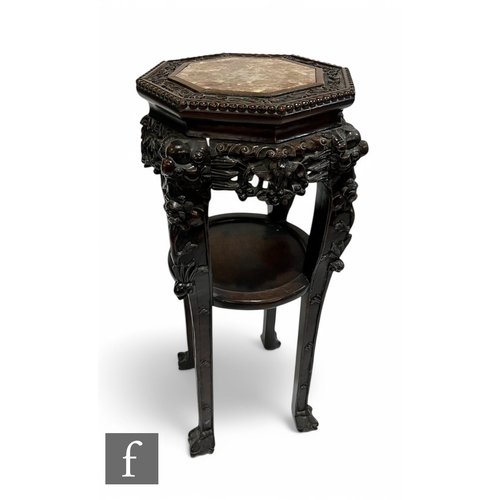 374 - A late 19th Century Chinese Hunghauli style carved octagonal hardwood jardiniere stand, rouge marble... 