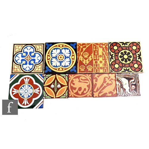 126 - A collection of William Godwin 6 inch and 4 inch encaustic tiles, to include majolica and slip glaze... 