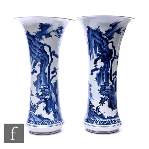 375 - A matched pair of Chinese blue and white Kangxi style vases, each of the slender trumpet form vase, ... 