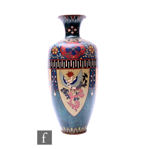 383 - An early 20th Century Japanese cloisonne vase, of slender ovoid form, decorated with a phoenix and f... 