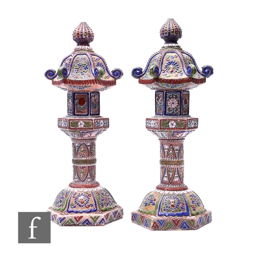 386 - A pair of early 20th Century Japanese pagoda incense burners, heavily enamelled with polychrome enam... 