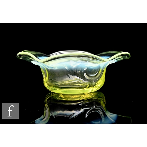 211 - A late 19th to early 20th Century Vaseline small glass bowl, of circular section with wavy rim, all ... 