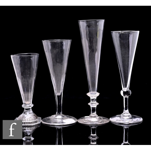 346 - A group of four late 18th and early 19th Century champagne flutes to include plain bowl with ball kn... 